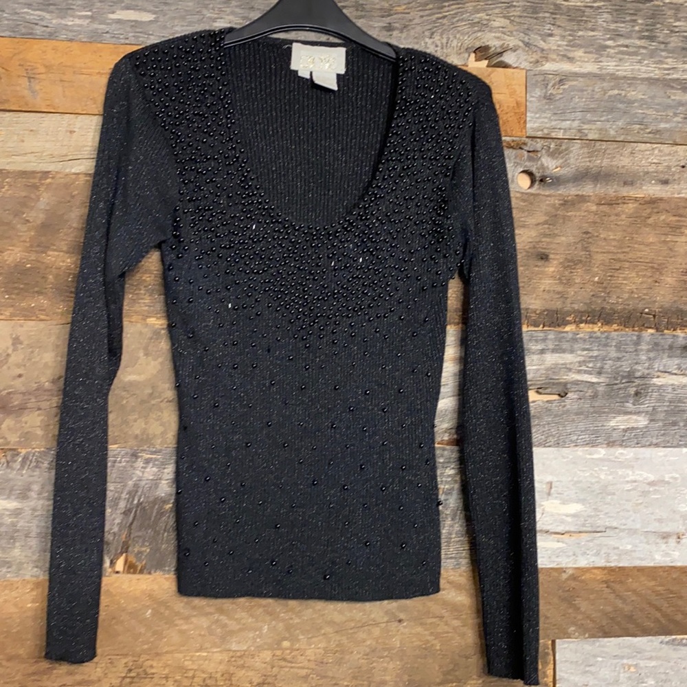 Beaded black sweater. The size large but I listed it as a medium It runs small